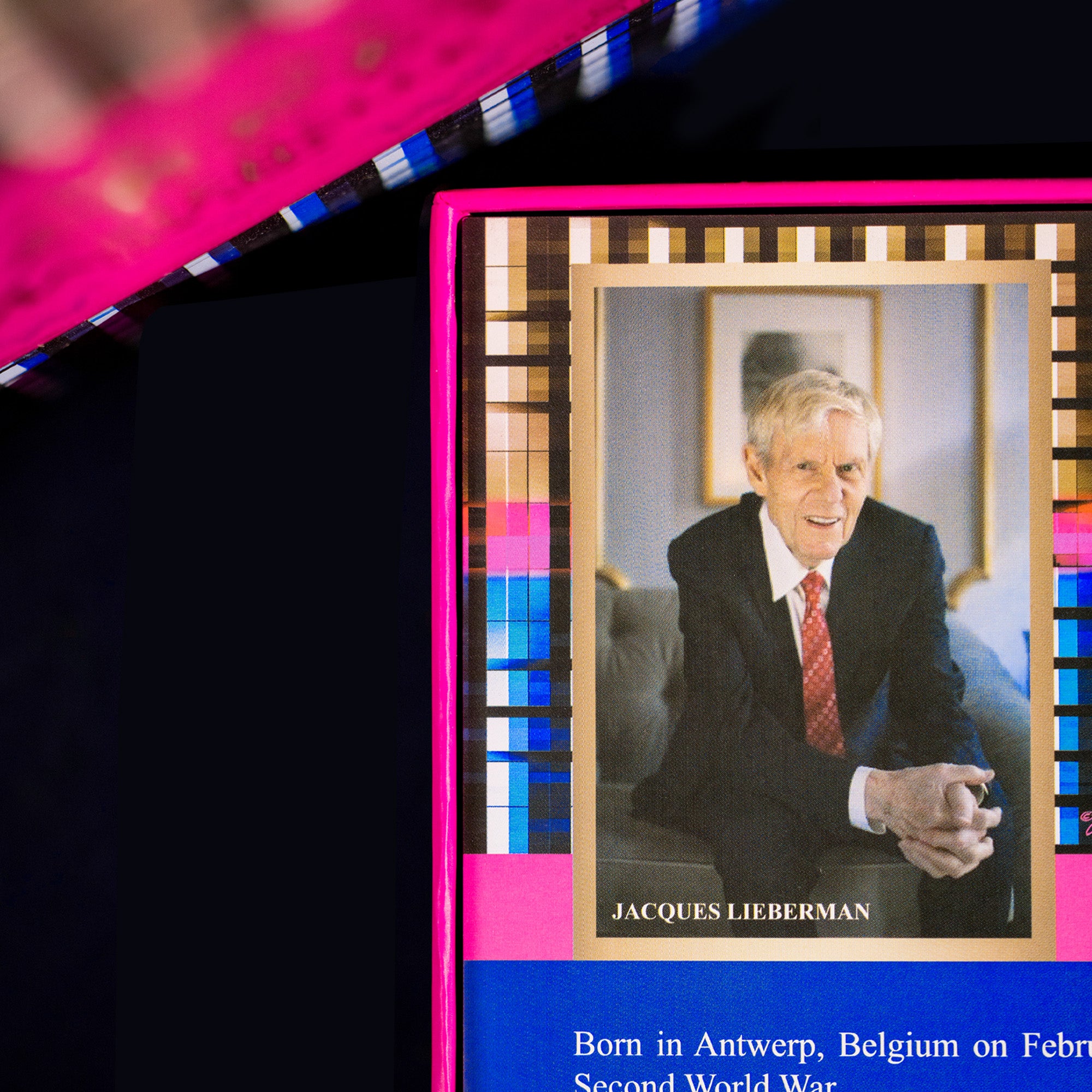 Card with a portrait of Jacques Lieberman, featuring a colorful border.