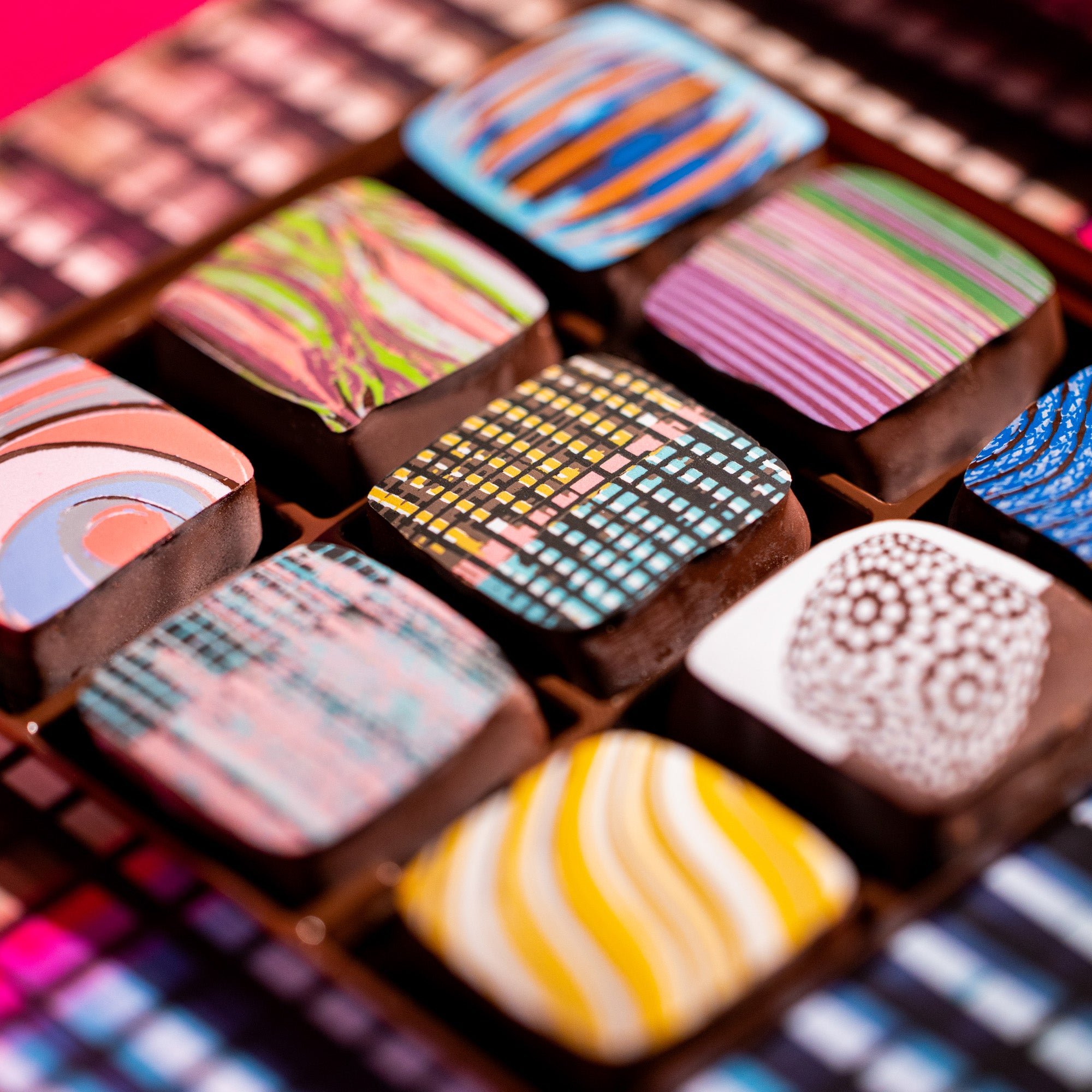 Assorted colorful chocolate caramels with various patterns