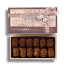 12pc Box of Cacao Market truffles with a decorative bow on a white background