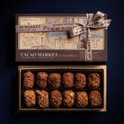 Box of chocolates from Cacao Market by MarieBelle on a dark background