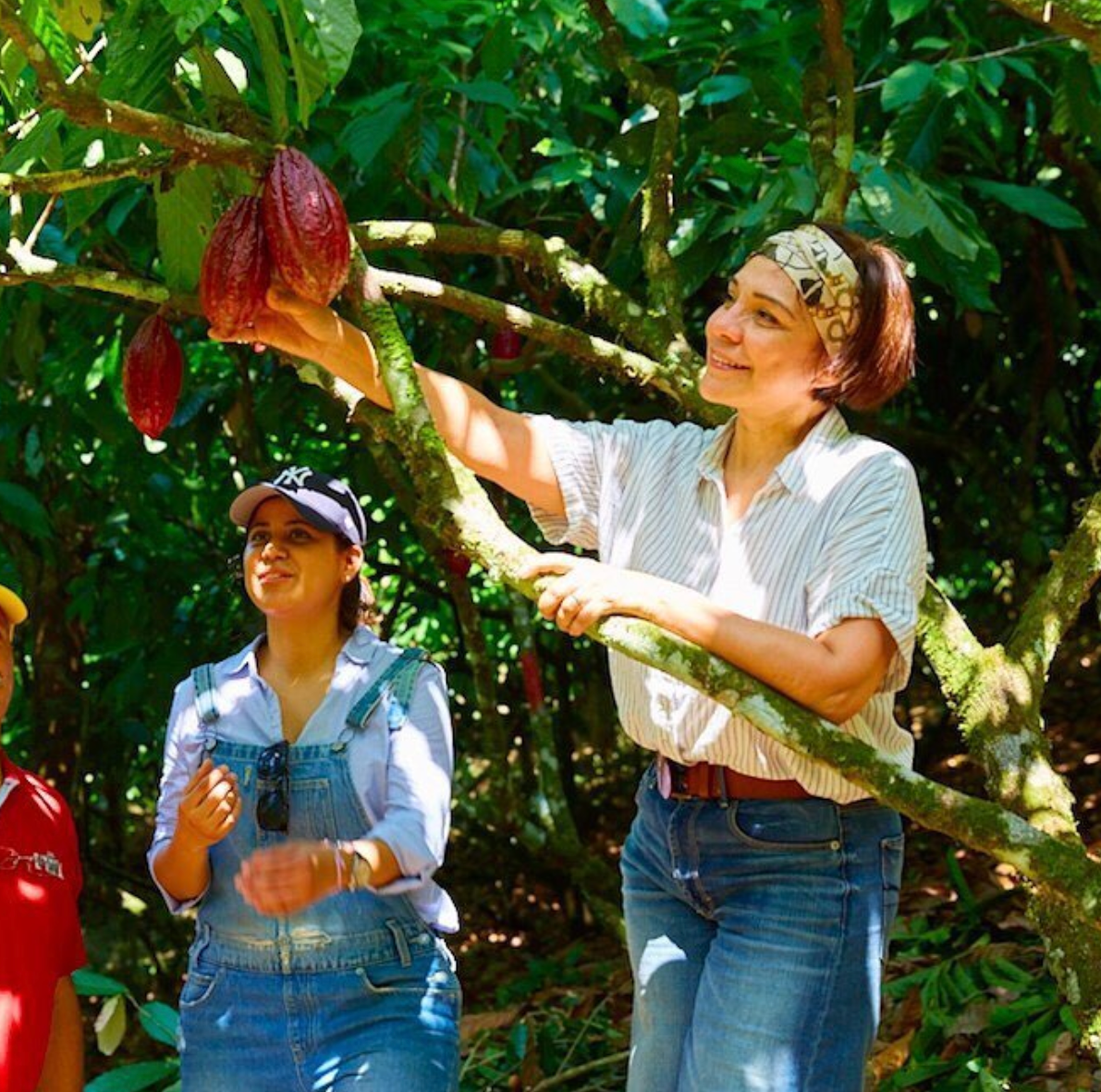 Maribel with a cacao tree.