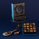 Decorative chocolate box with intricate design on a dark blue background