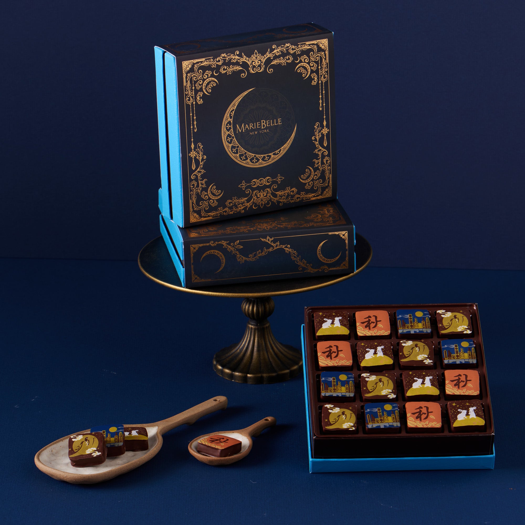 Decorative chocolate box with intricate design on a dark blue background