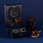 MarieBelle chocolate packaging with brownies and tea set on a blue background
