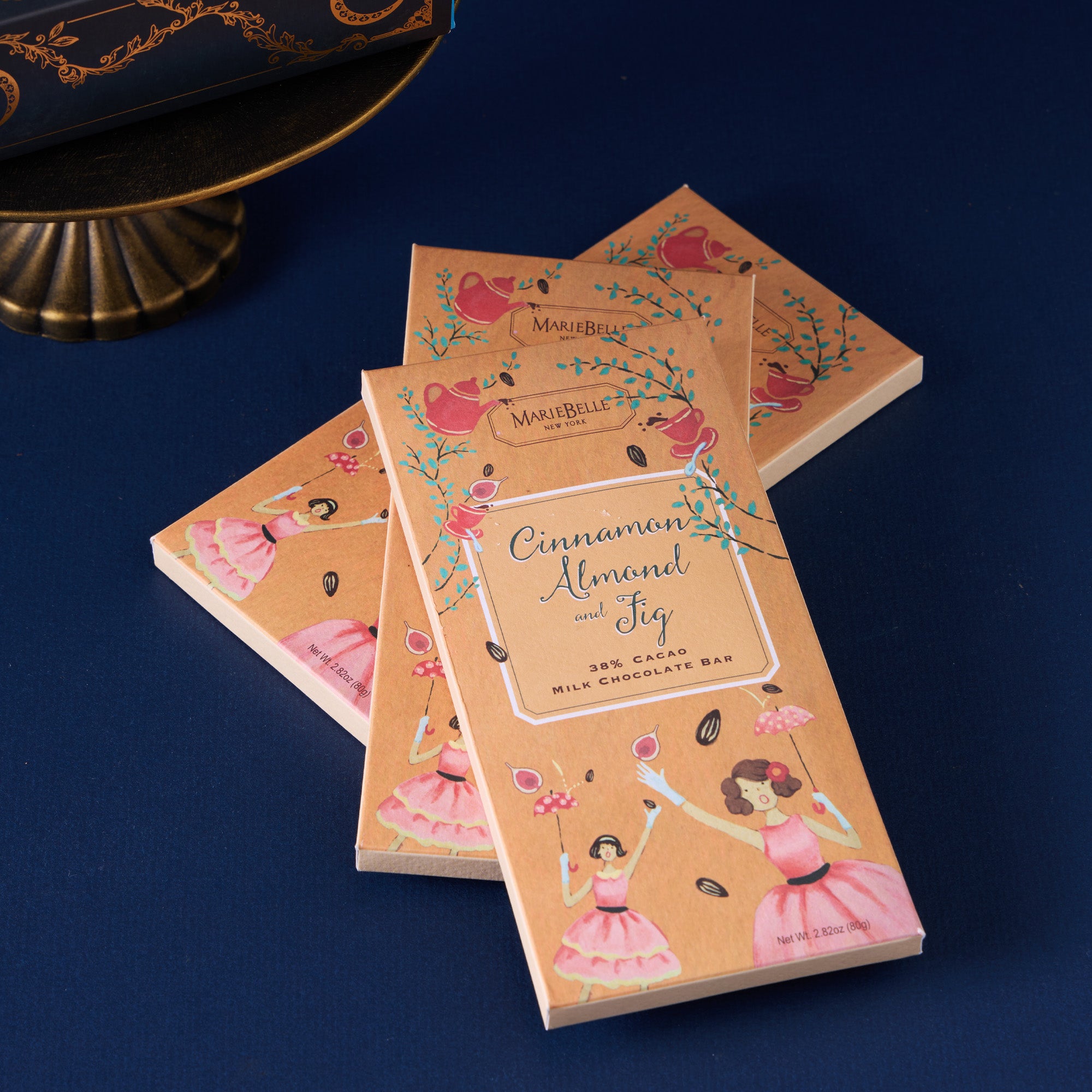 MarieBelle chocolate bars with decorative packaging on a dark blue background